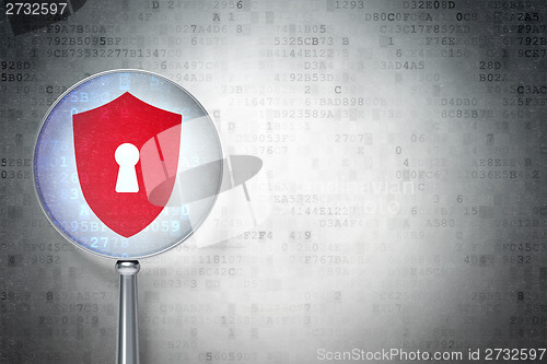 Image of Security concept:  Shield With Keyhole with optical glass on digital background