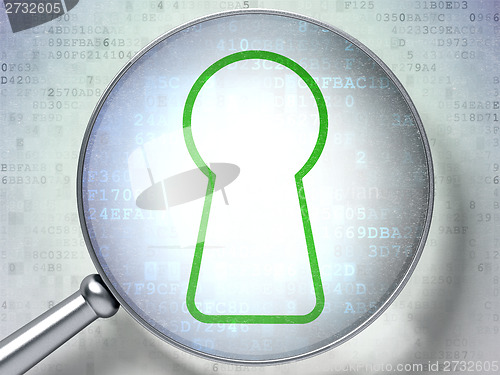 Image of Information concept: Keyhole with optical glass on digital background