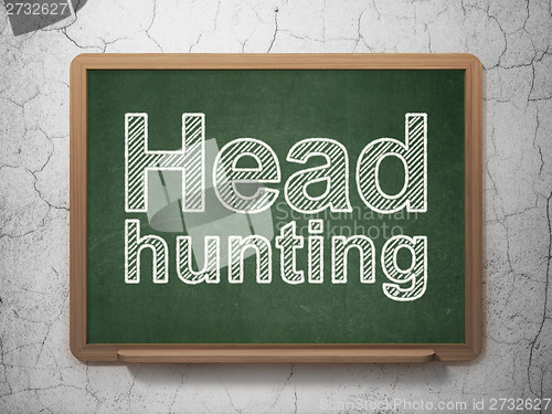 Image of Business concept: Head Hunting on chalkboard background