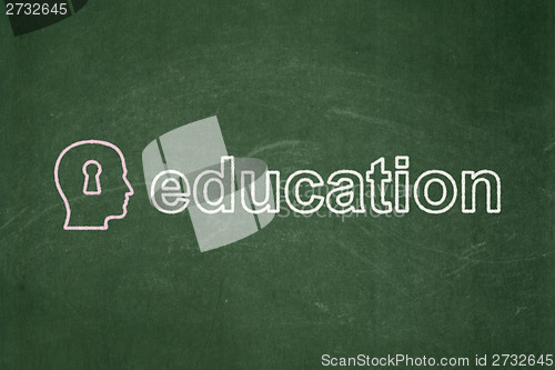 Image of Education concept: Head With Keyhole and Education on chalkboard background