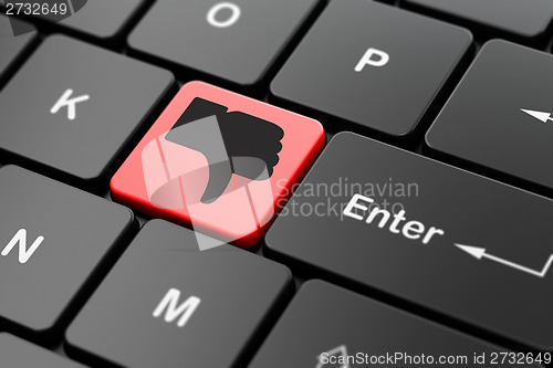 Image of Social media concept: Thumb Down on computer keyboard background