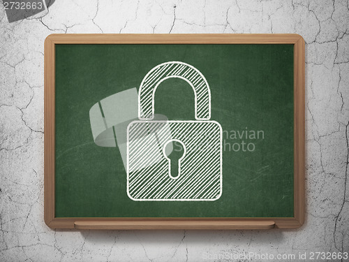 Image of Information concept: Closed Padlock on chalkboard background