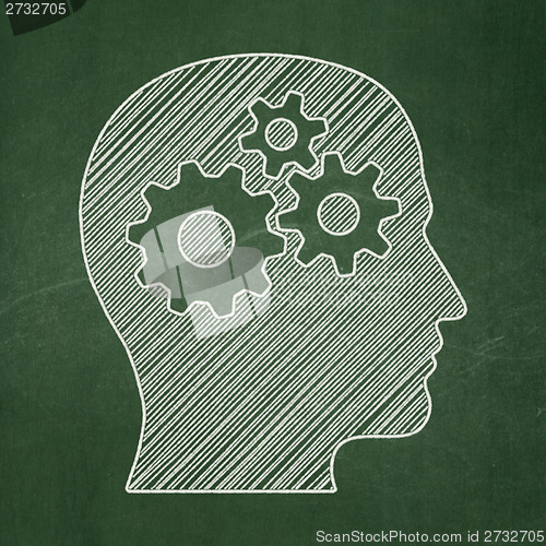 Image of Information concept: Head With Gears on chalkboard background