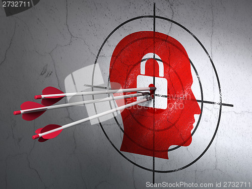 Image of Business concept: arrows in Head With Padlock target on wall background