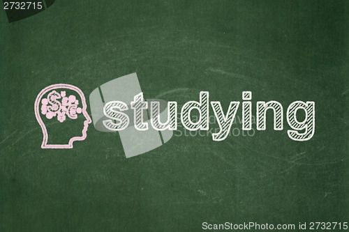 Image of Education concept: Head With Finance Symbol and Studying on chalkboard background