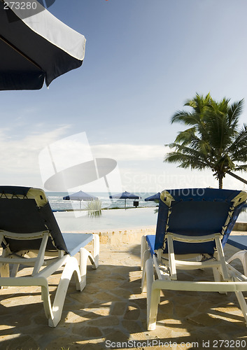 Image of lounge chairs by pool