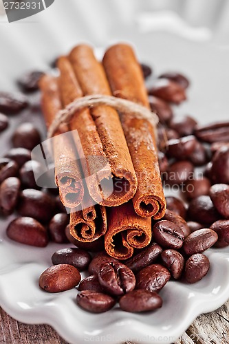 Image of stack of cinnamon sticks and coffee beans
