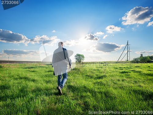 Image of Man walking on the field