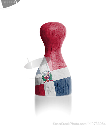 Image of Wooden pawn with a flag painting