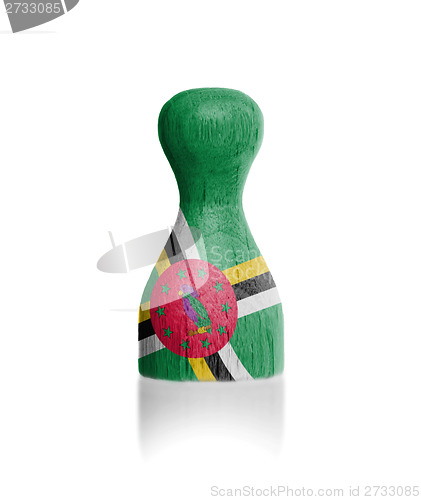 Image of Wooden pawn with a flag painting