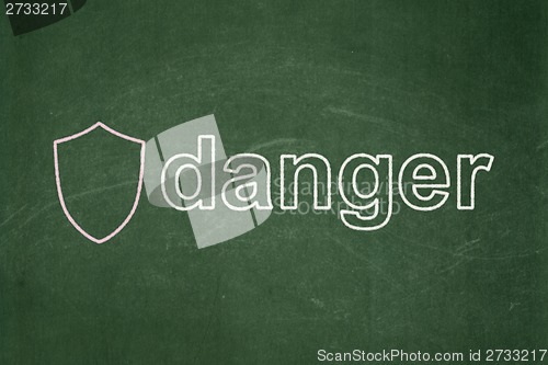 Image of Security concept: Shield and Danger on chalkboard background