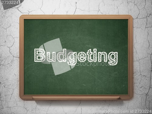 Image of Finance concept: Budgeting on chalkboard background