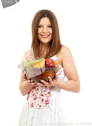 Image of brunette girl holding cup of fruits