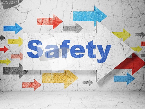 Image of Safety concept: arrow with Safety on grunge wall background