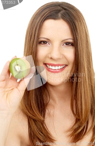 Image of beautiful brunette showing fresh kiwi