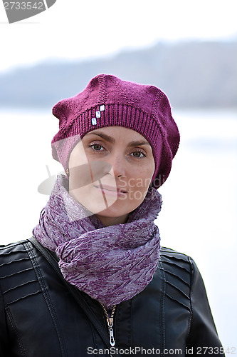 Image of Woman in a red beret and a black jacket