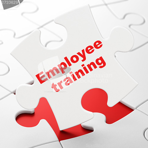 Image of Education concept: Employee Training on puzzle background