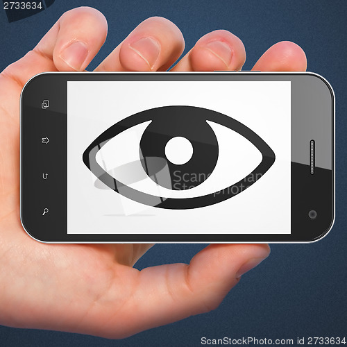 Image of Security concept: Eye on smartphone