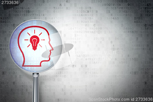 Image of Finance concept:  Head With Lightbulb with optical glass