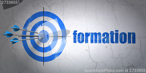 Image of Education concept: target and Formation on wall background
