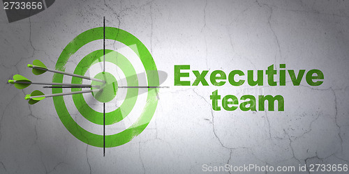 Image of Business concept: target and Executive Team on wall background