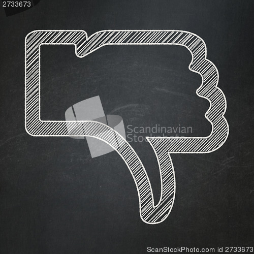 Image of Social network concept: Thumb Down on chalkboard background