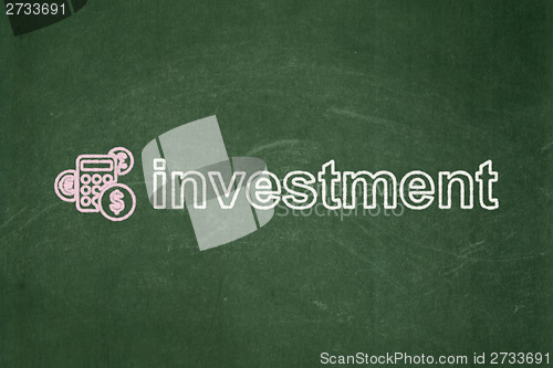 Image of Finance concept: Calculator and Investment on chalkboard