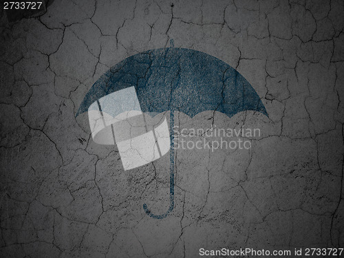 Image of Security concept: Umbrella on grunge wall background