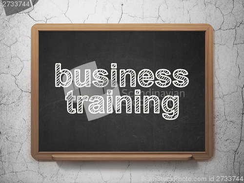 Image of Education concept: Business Training on chalkboard background
