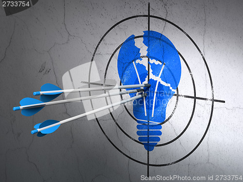 Image of Business concept: arrows in Light Bulb target on wall background