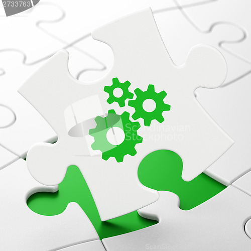 Image of Information concept: Gears on puzzle background