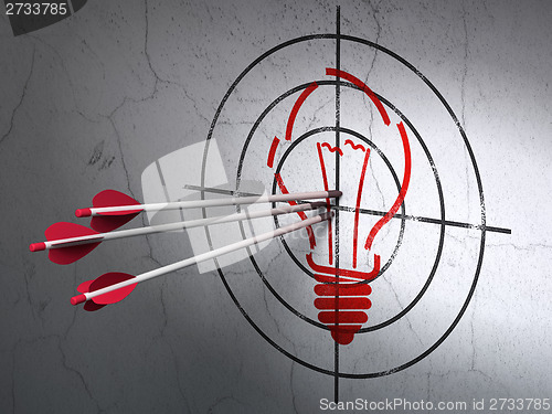 Image of Finance concept: arrows in Light Bulb target on wall background