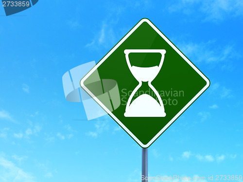Image of Timeline concept: Hourglass on road sign background