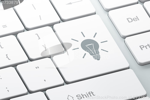 Image of Finance concept: Light Bulb on computer keyboard background