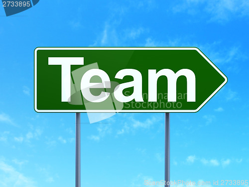 Image of Business concept: Team on road sign background