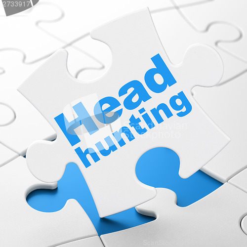 Image of Business concept: Head Hunting on puzzle background