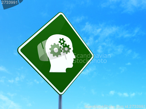 Image of Business concept: Head With Gears on road sign background