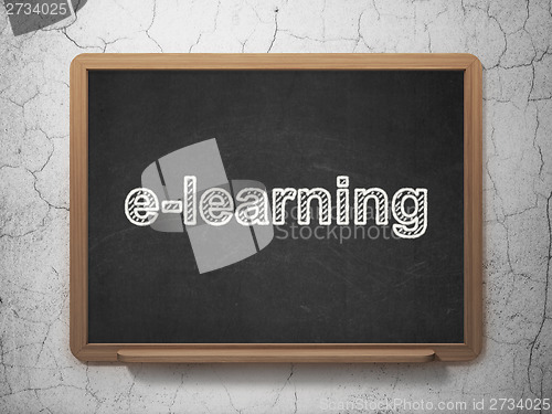 Image of Education concept: E-learning on chalkboard background