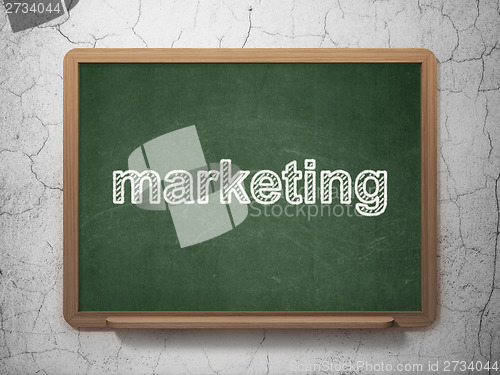 Image of Advertising concept: Marketing on chalkboard background