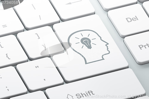 Image of Data concept: Head With Lightbulb on keyboard background