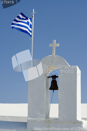 Image of greek island church and bells with flag