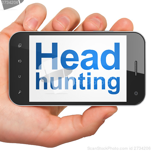Image of Finance concept: Head Hunting on smartphone