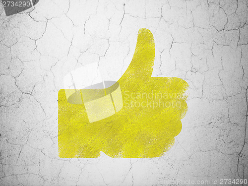 Image of Social network concept: Thumb Up on wall background