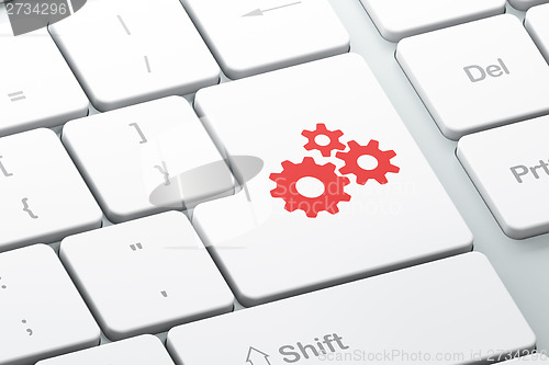 Image of Data concept: Gears on computer keyboard background