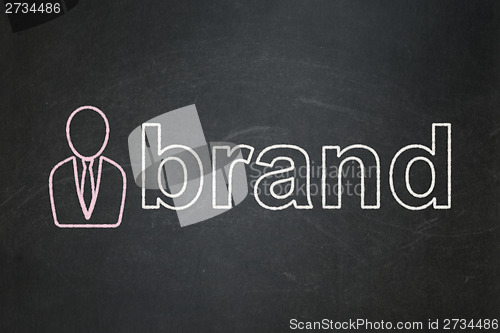 Image of Marketing concept: Business Man and Brand on chalkboard background
