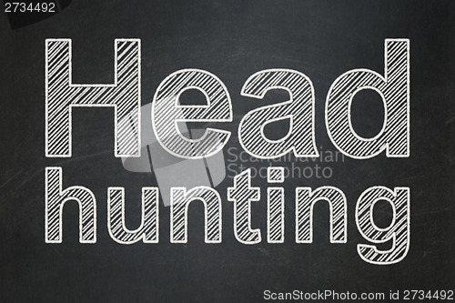Image of Finance concept: Head Hunting on chalkboard background