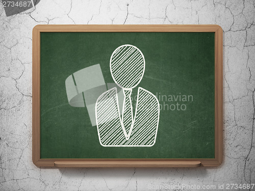 Image of Marketing concept: Business Man on chalkboard background