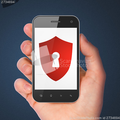 Image of Protection concept: Shield With Keyhole on smartphone