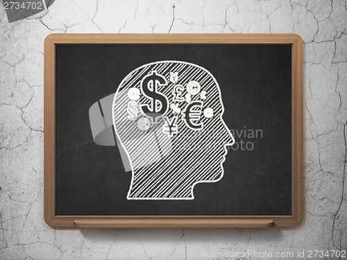 Image of Advertising concept: Head With Finance Symbol on chalkboard