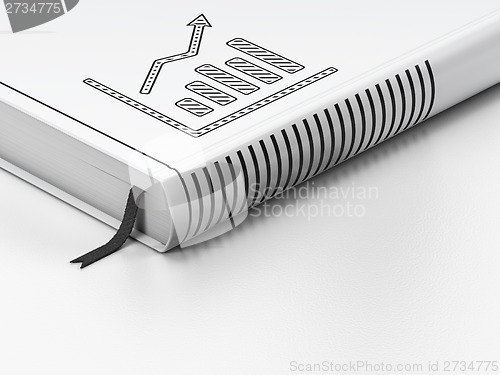 Image of Finance concept: closed book, Growth Graph on white background